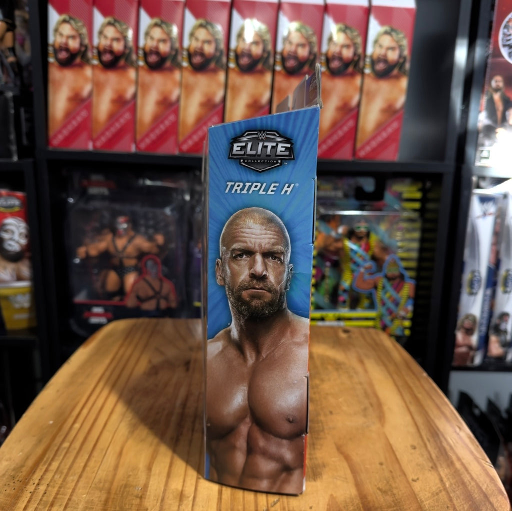 Elite action figure box with Triple H headshot, blue packaging and Elite logo