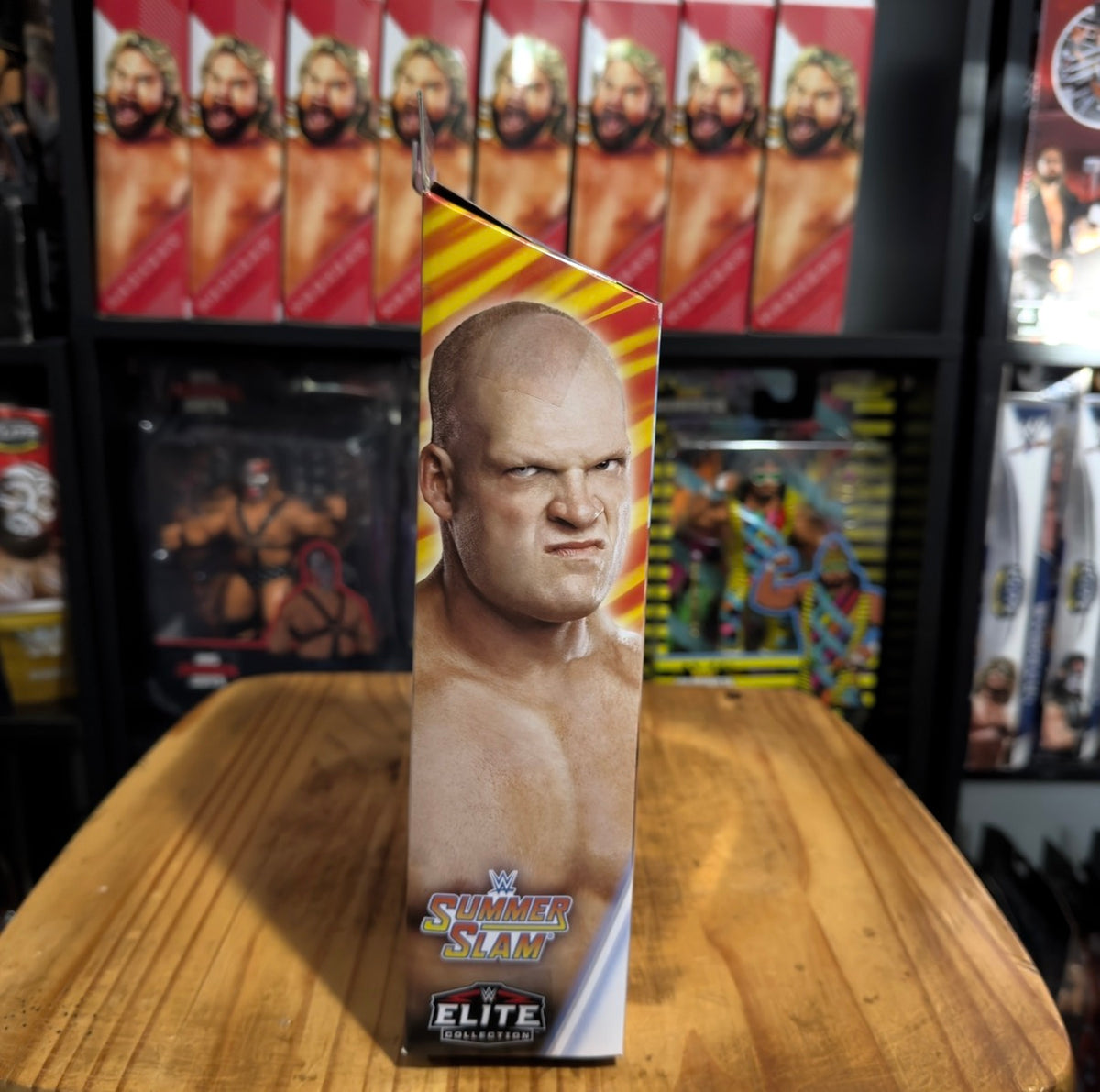 Kane WWE Elite SummerSlam action figure box with bald wrestler portrait on front