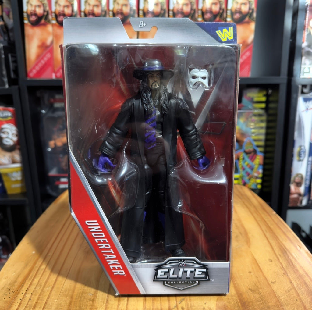 Undertaker WWE Elite action figure in black outfit with purple gloves and face mask accessory