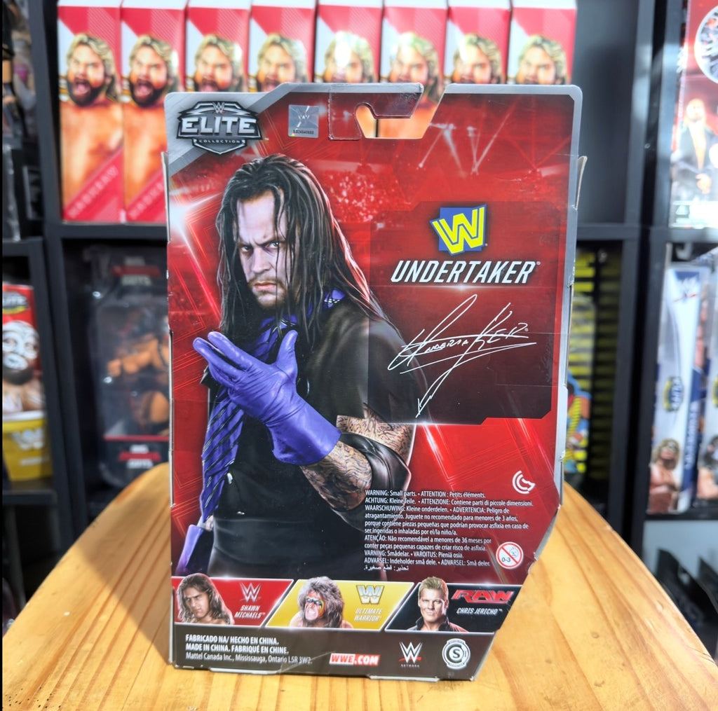 Undertaker WWE Elite Flashback boxed figure, Undertaker portrait with purple glove pose