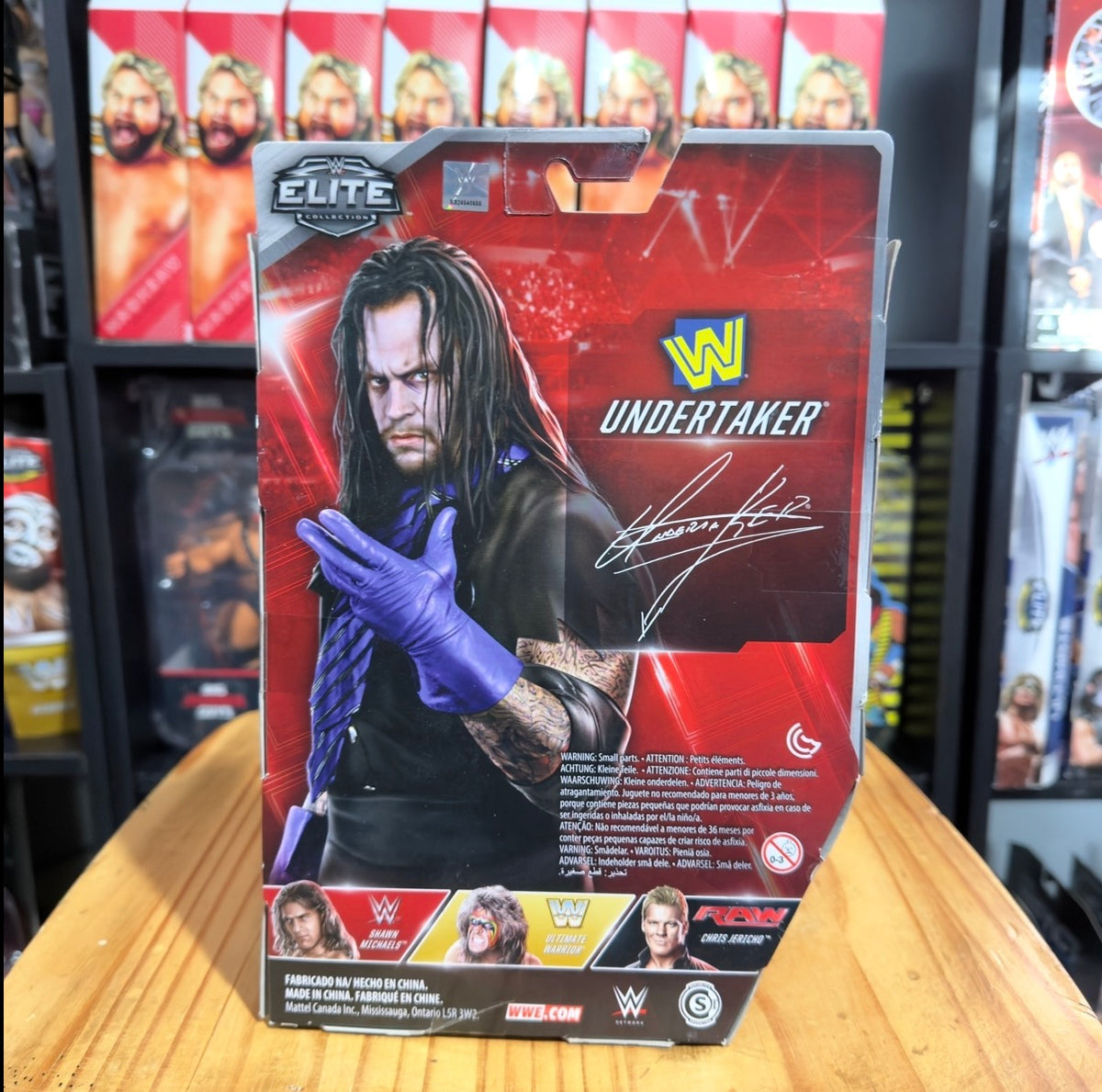 Undertaker WWE Elite Flashback boxed figure, Undertaker portrait with purple glove pose