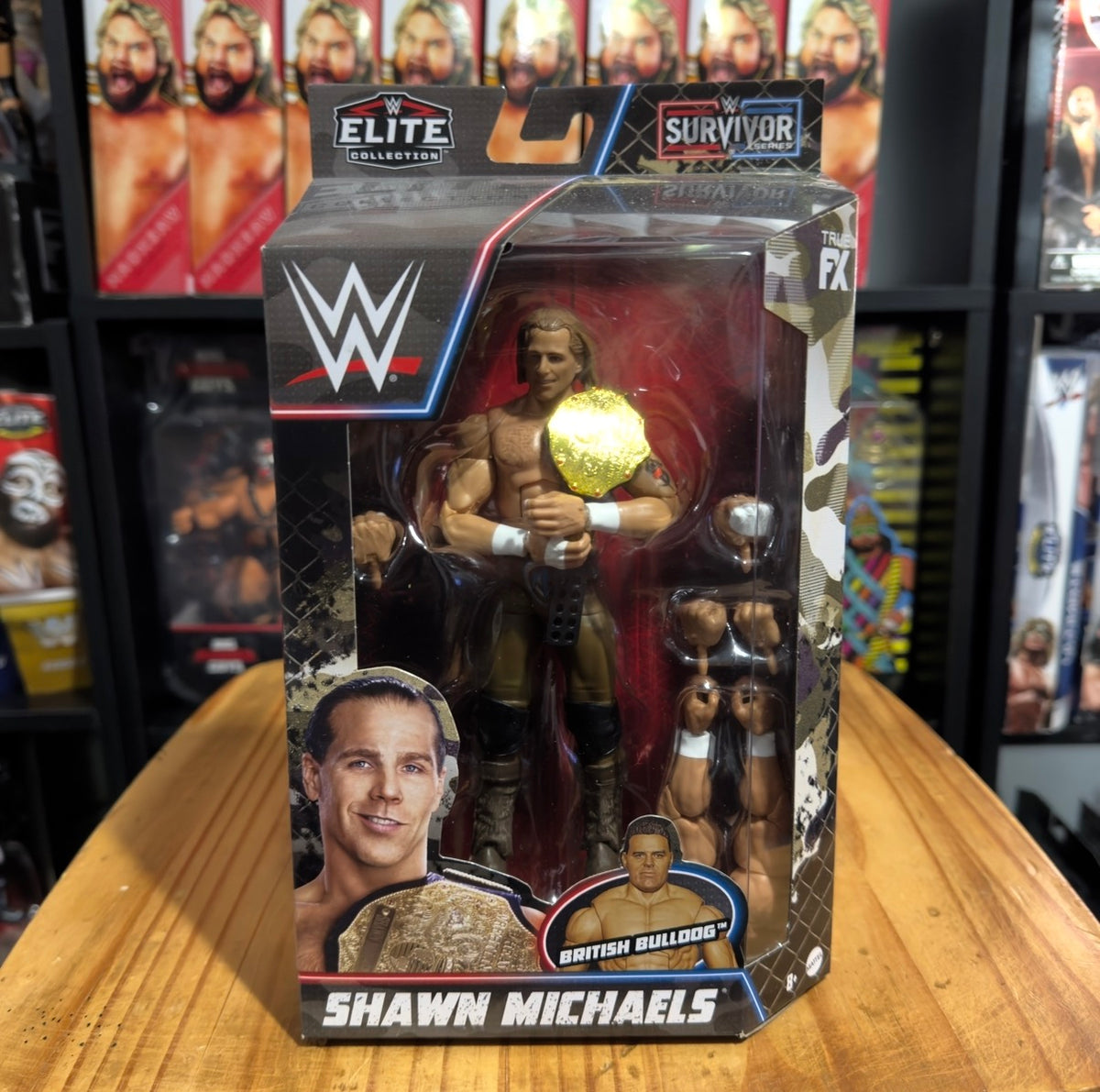 Boxed WWE Elite Collection action figure showing Shawn Michaels holding a gold belt