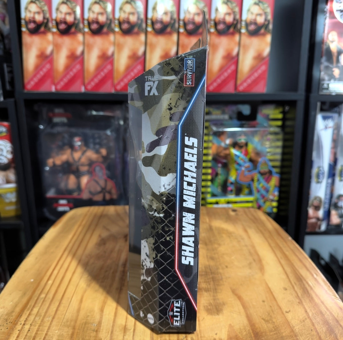 Boxed WWE Elite Collection action figure box side with Shawn Michaels name and camo art