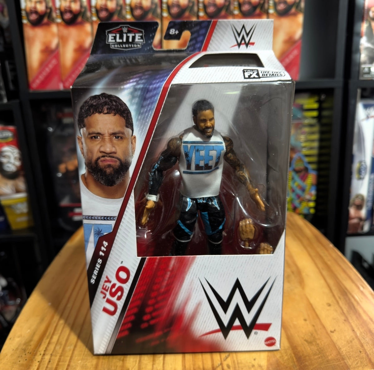 WWE Elite Jey Uso action figure in window box, figure posed with raised arms