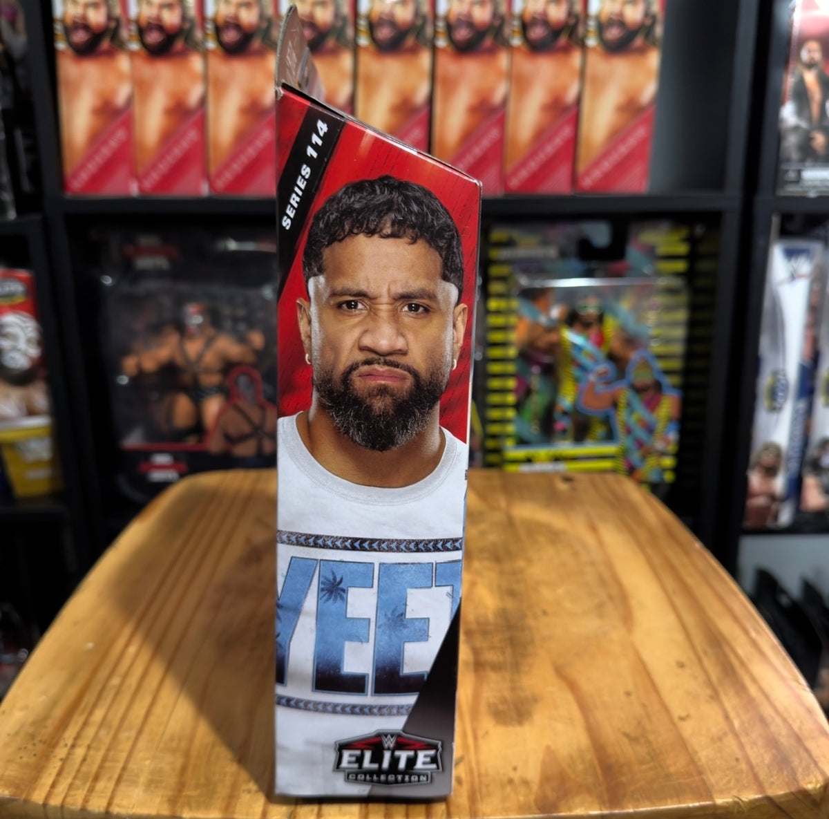 WWE Elite Jey Uso action figure box with window and portrait, red and blue accents