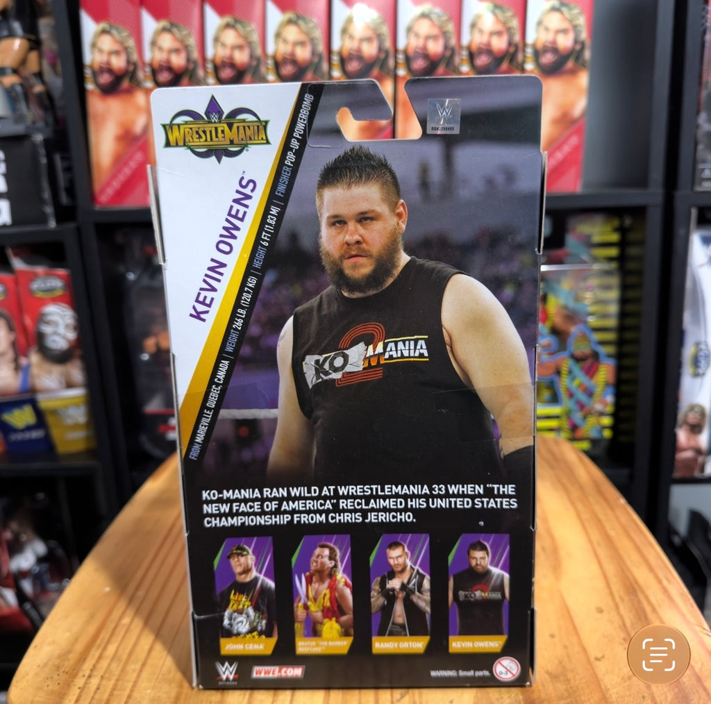 WWE Elite Collection action figure in box with Kevin Owens artwork, front view