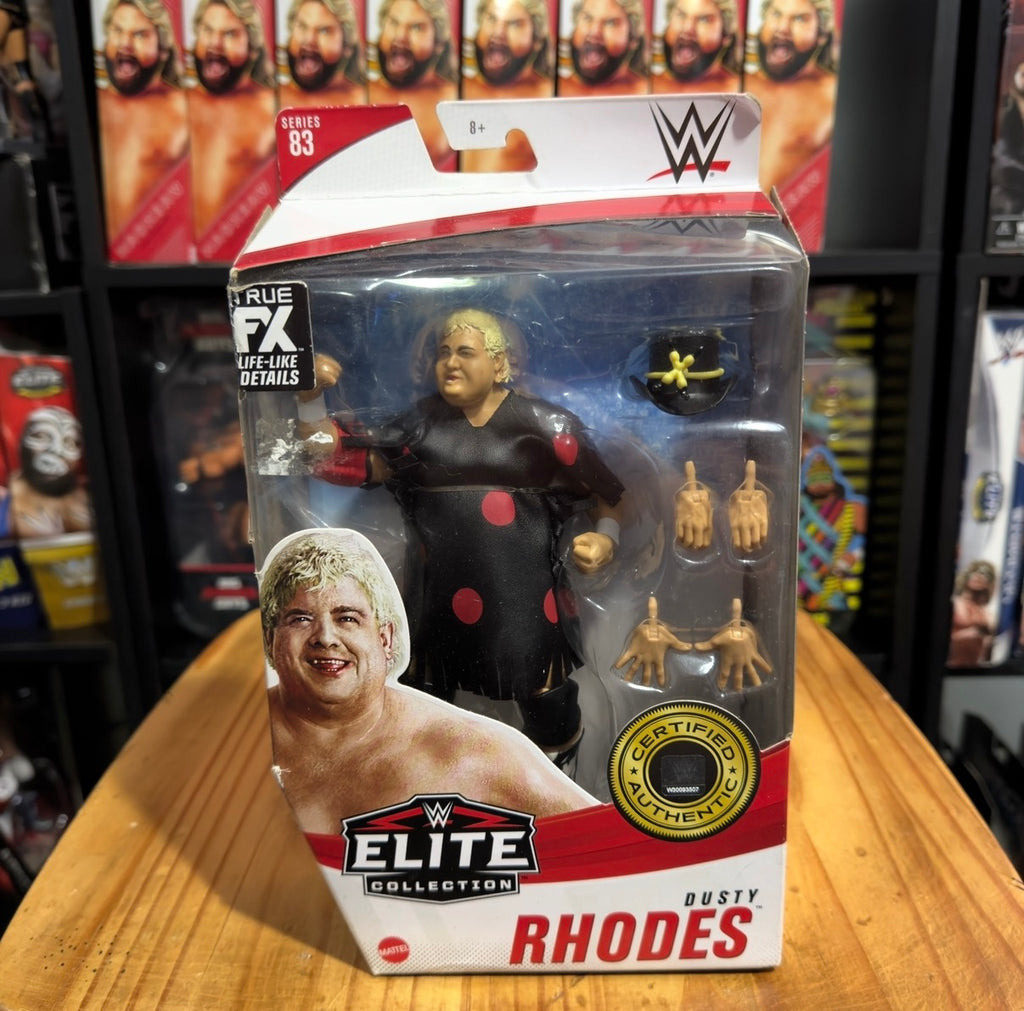 WWE Elite Collection action figure box showing blonde wrestler in black suit