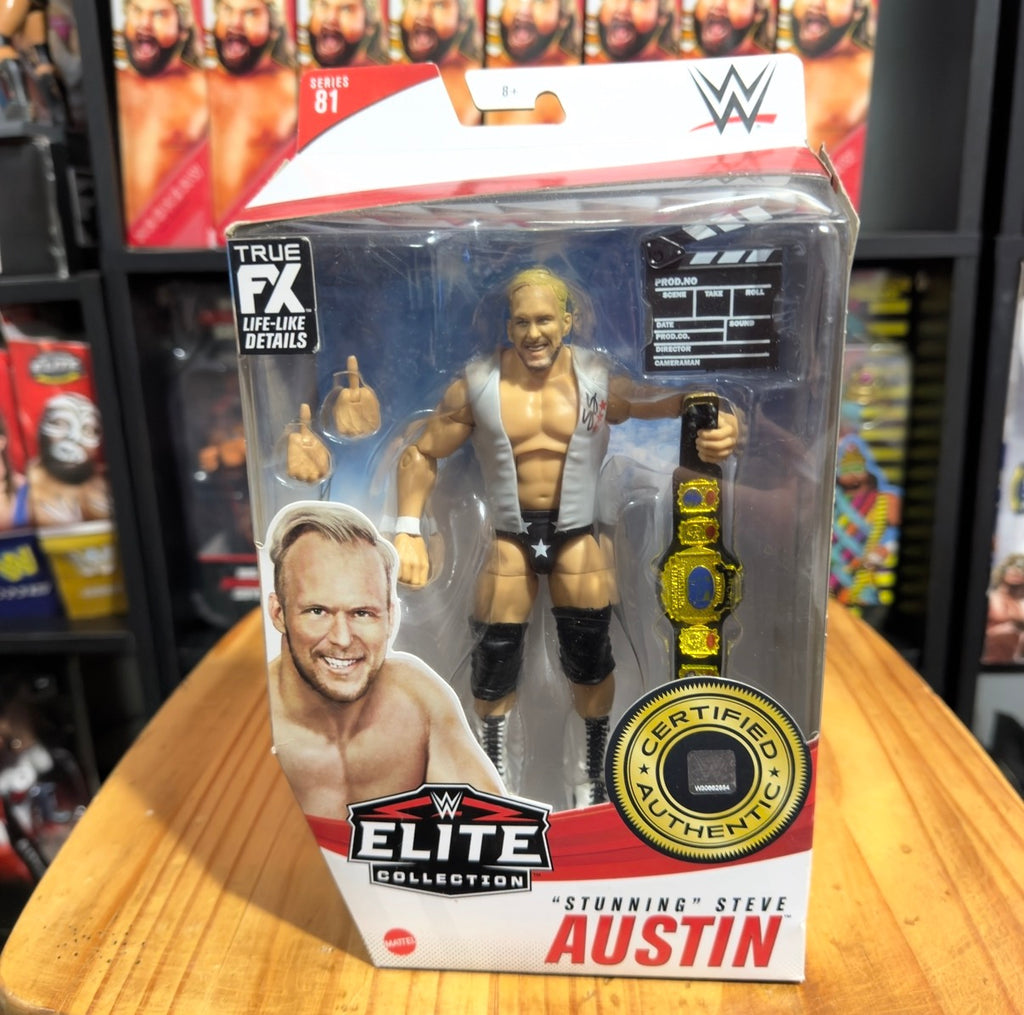 WWE Elite action figure box showing wrestler figure and gold championship belt