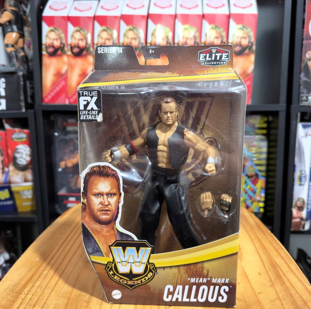 WWE Elite action figure in black vest and pants, boxed for retail