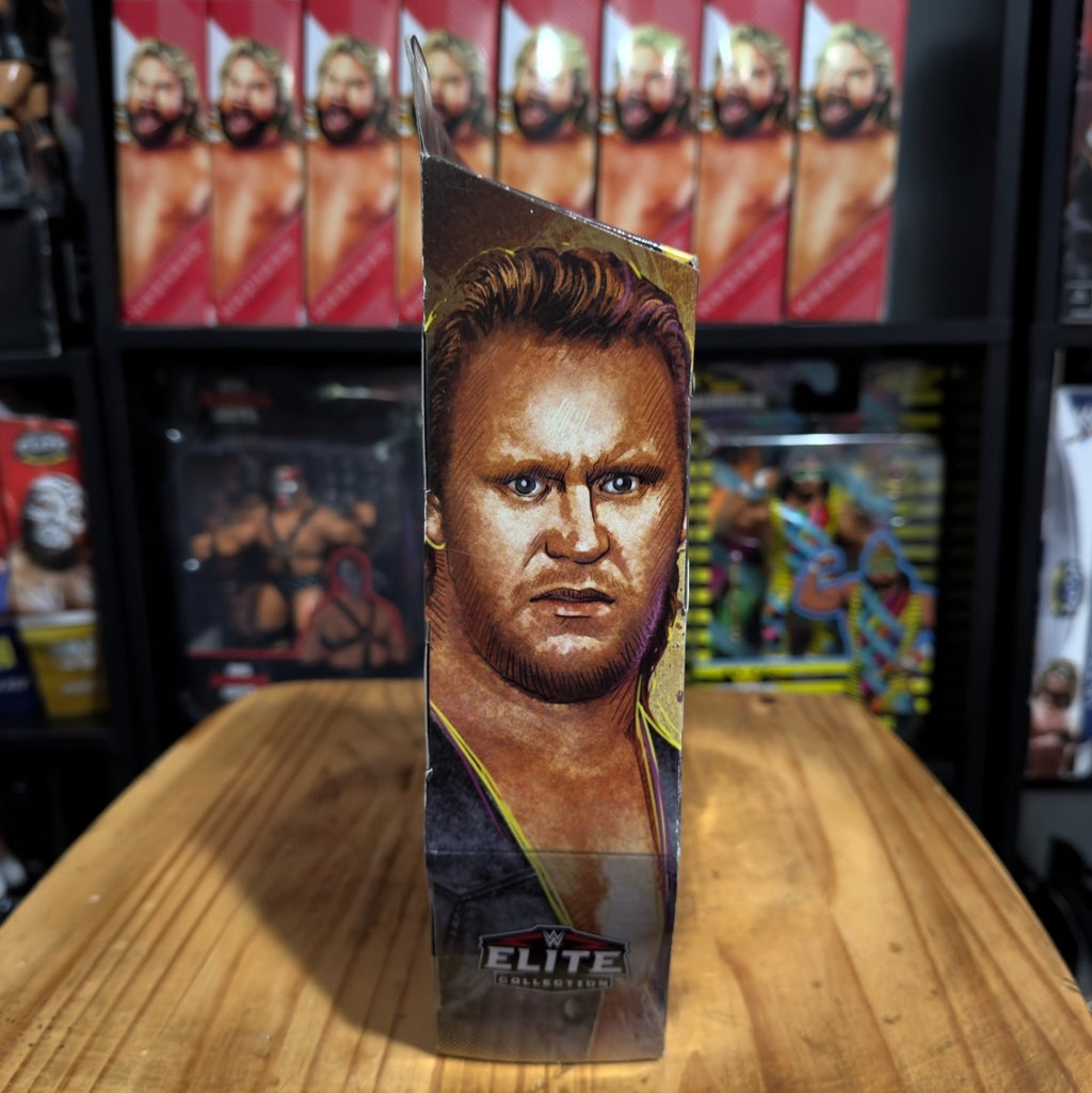 WWE Elite action figure box side with close-up face portrait and Elite logo