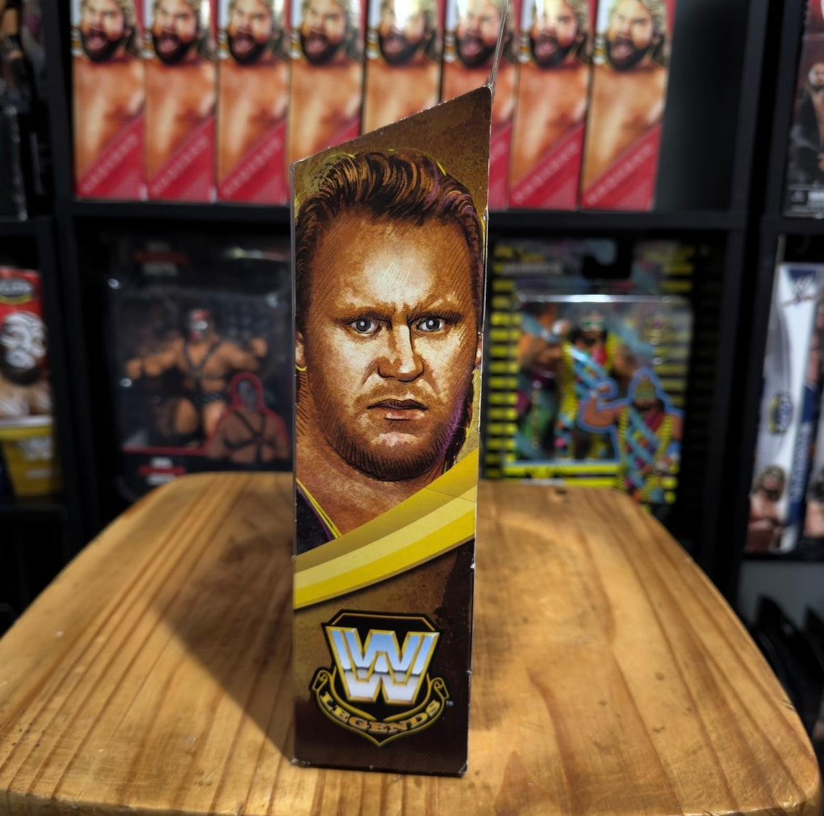 WWE Elite action figure box side panel with character portrait and WWE logo
