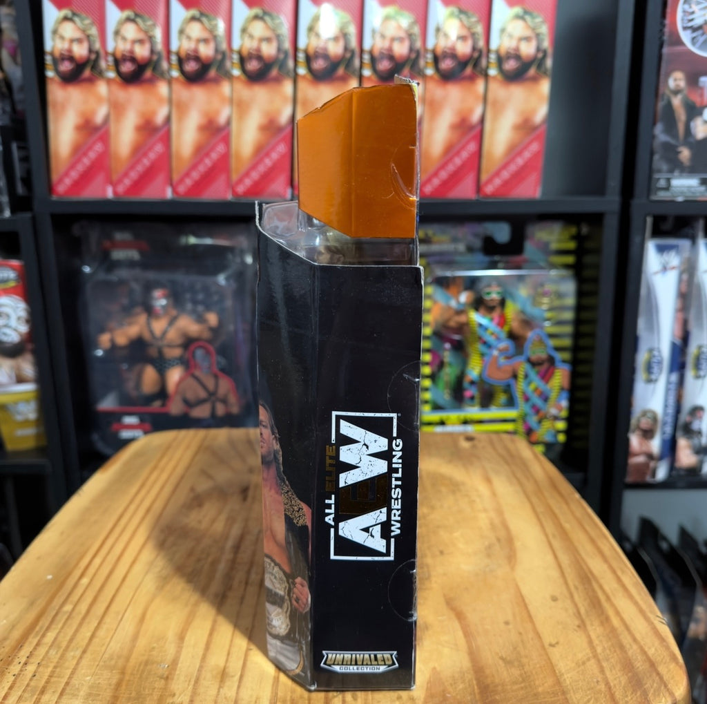 AEW wrestling figure packaging showing side graphics and logo on boxed figure