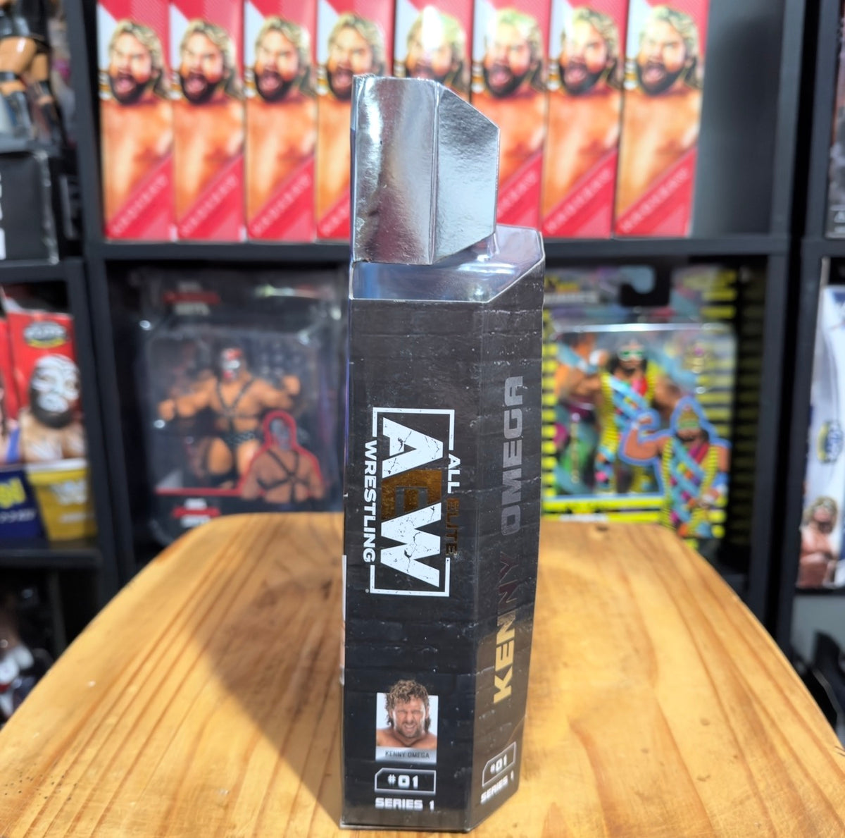 AEW Unmatched action figure packaging side panel with Kenny Omega branding