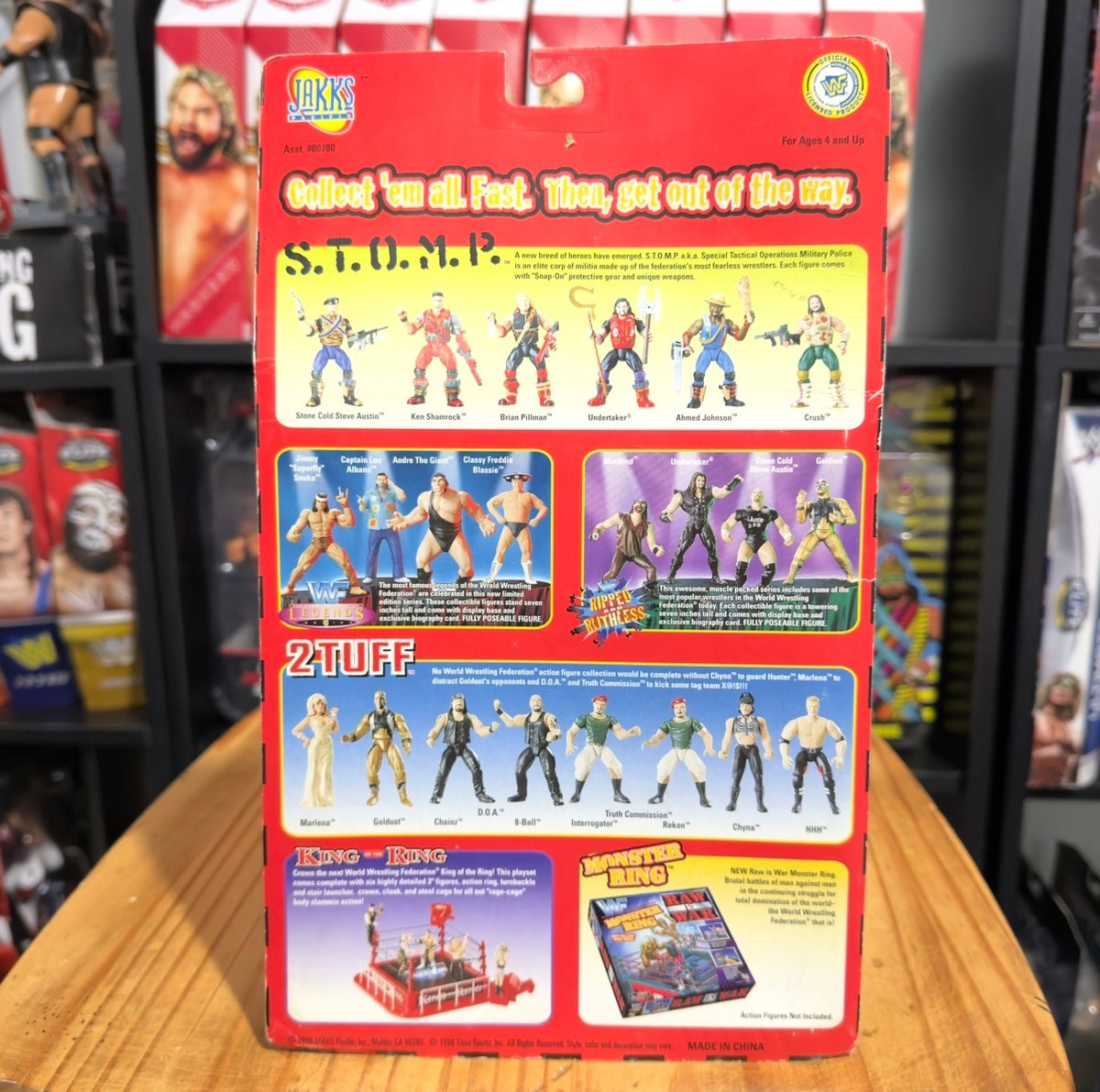 WWE action figure package back with character lineup and accessory graphics