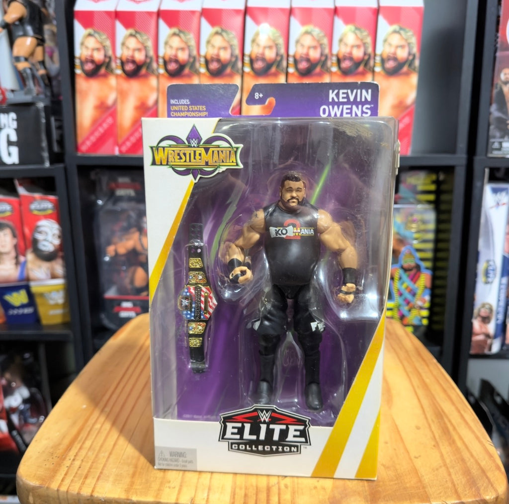 Kevin Owens Elite Collection action figure in retail package, purple and yellow branding