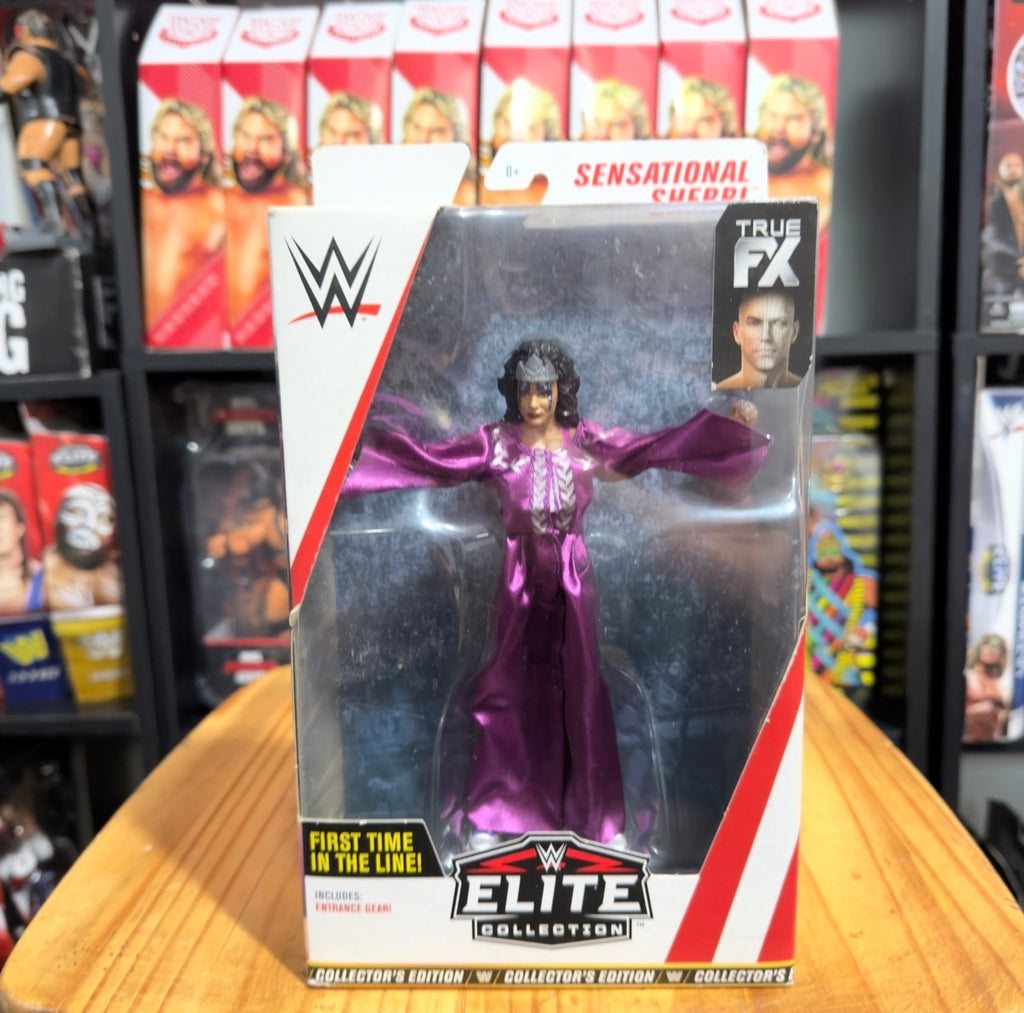 WWE Elite wrestling action figure in purple satin robe, boxed front view