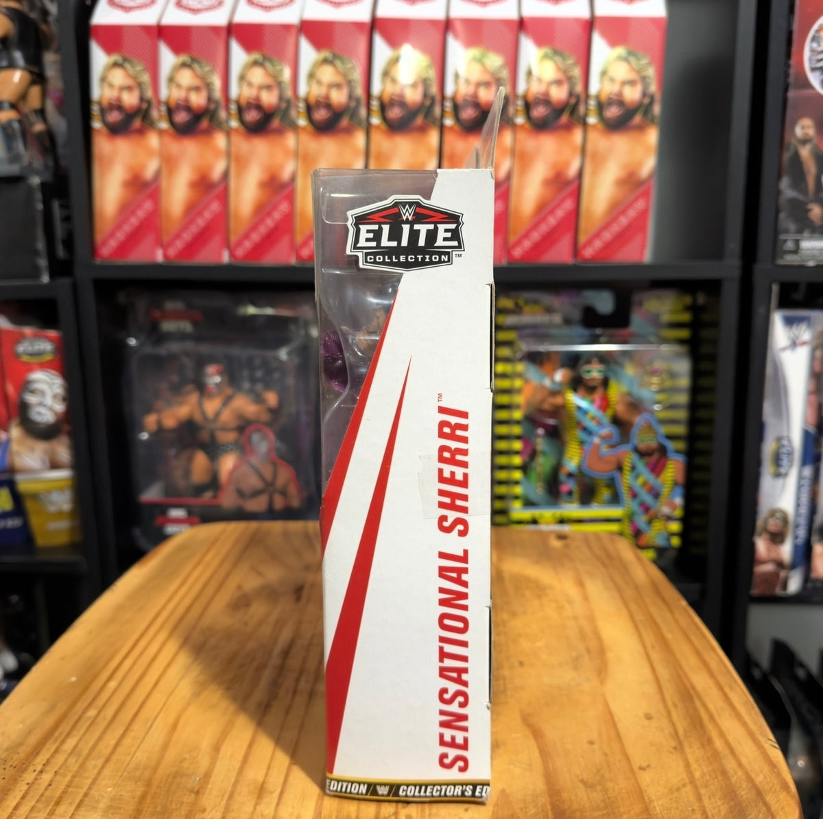 WWE Elite action figure box side panel with red “Sensational Sherri” text