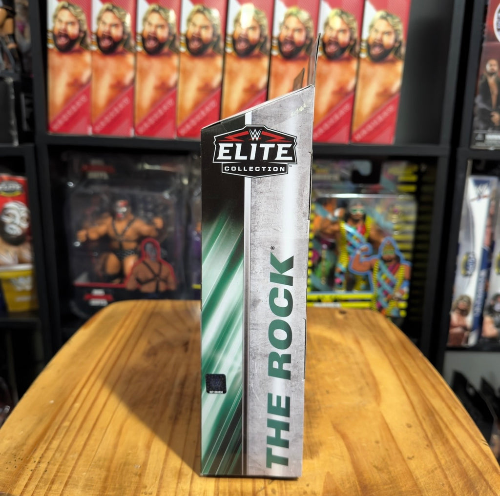 WWE Elite Collection The Rock action figure box with green vertical branding