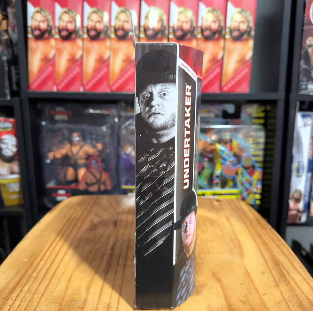 WWE Undertaker action figure box with vertical side art and Undertaker portrait