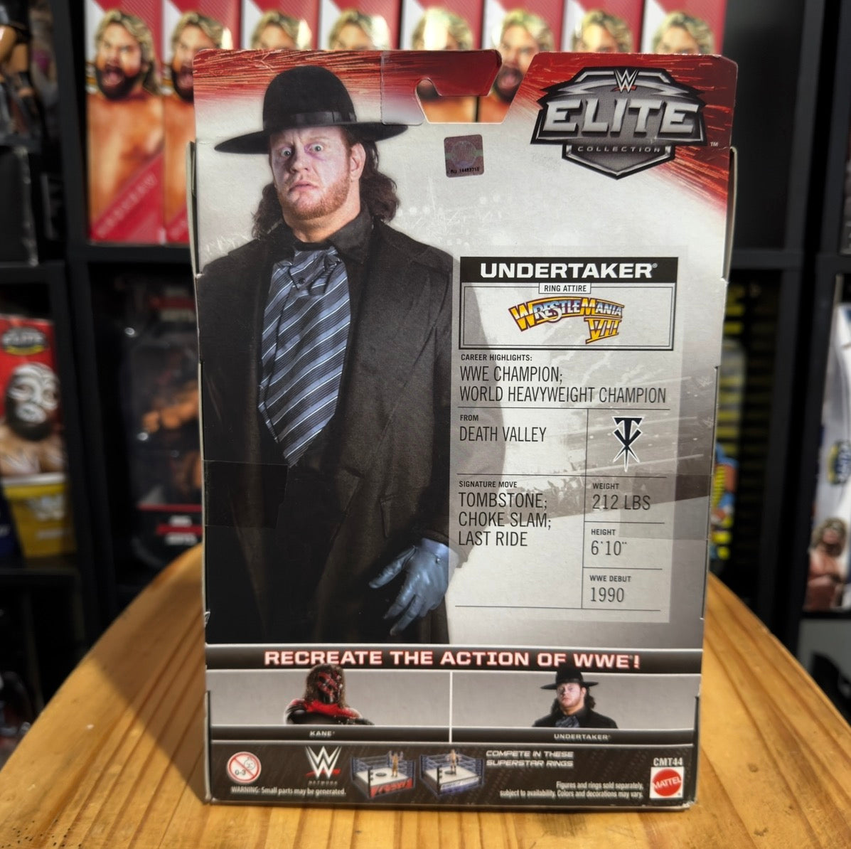WWE Undertaker boxed figure with collectible stats card and Elite logo on top