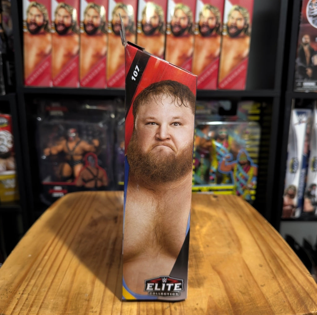 Otis action figure box, side view with wrestler face artwork and Elite badge