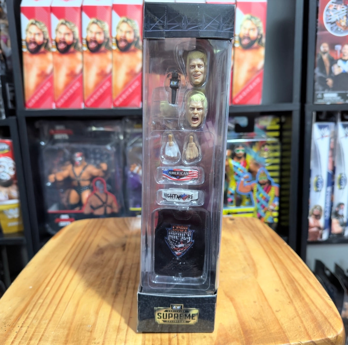 Boxed figure accessory layout in clear blister with 'Supreme Collection' badge