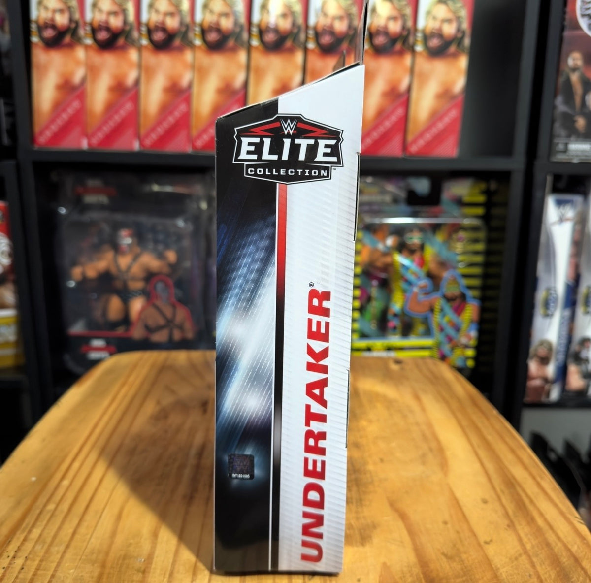 Undertaker WWE Elite action figure box side with vertical red and white branding