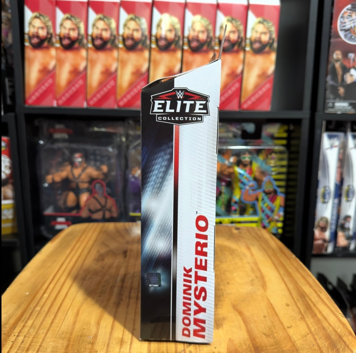 Boxed action figure package side with red vertical "Mysterio" branding on white
