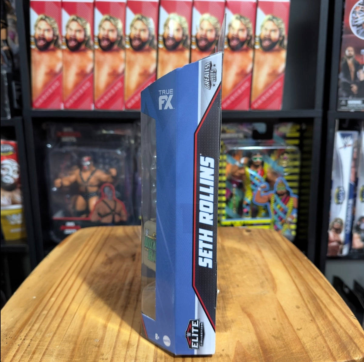 WWE Elite action figure box side with Seth Rollins text and Elite logo