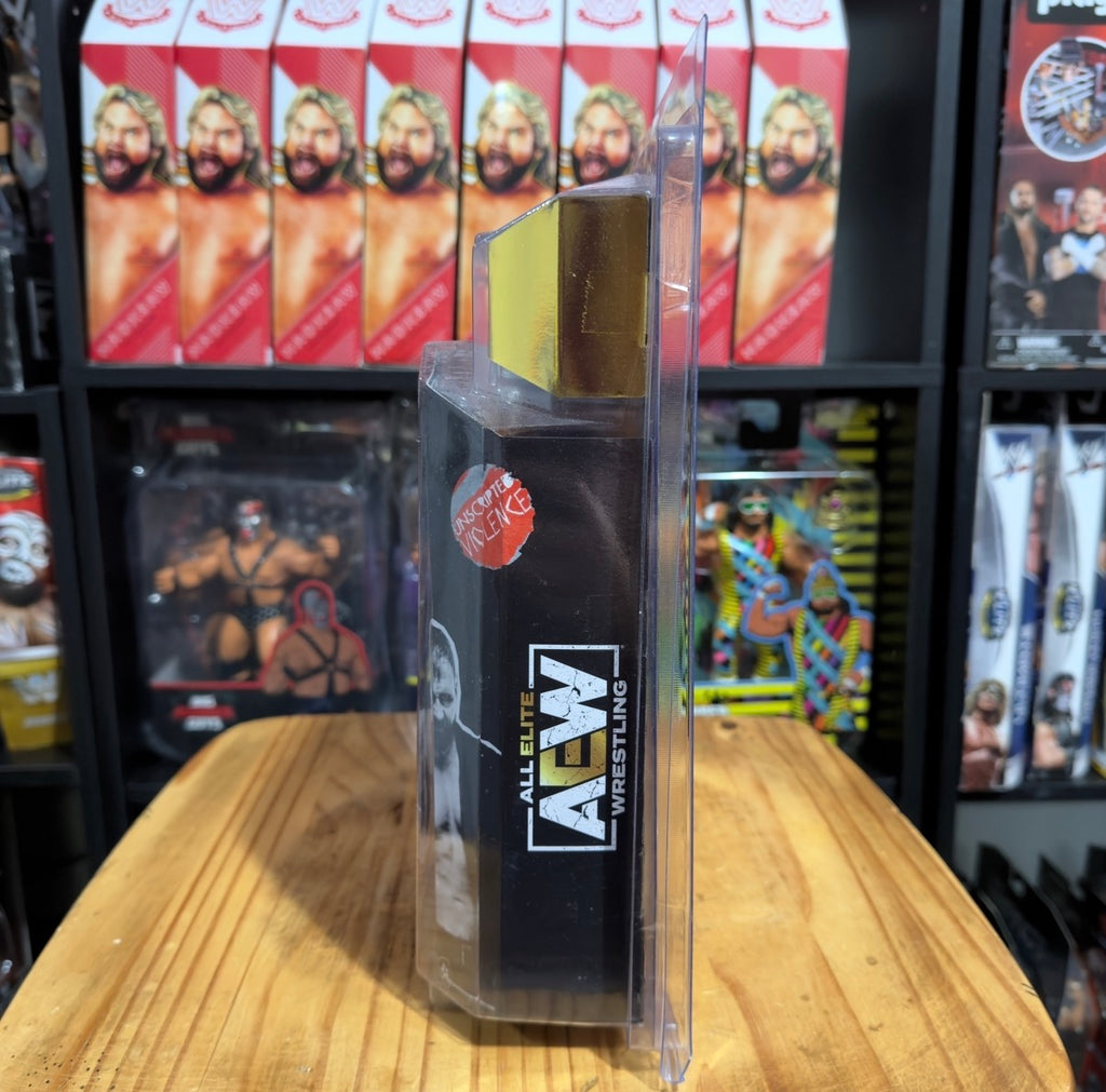 Jon Moxley AEW action figure in clear packaging showing side AU and AEW logos