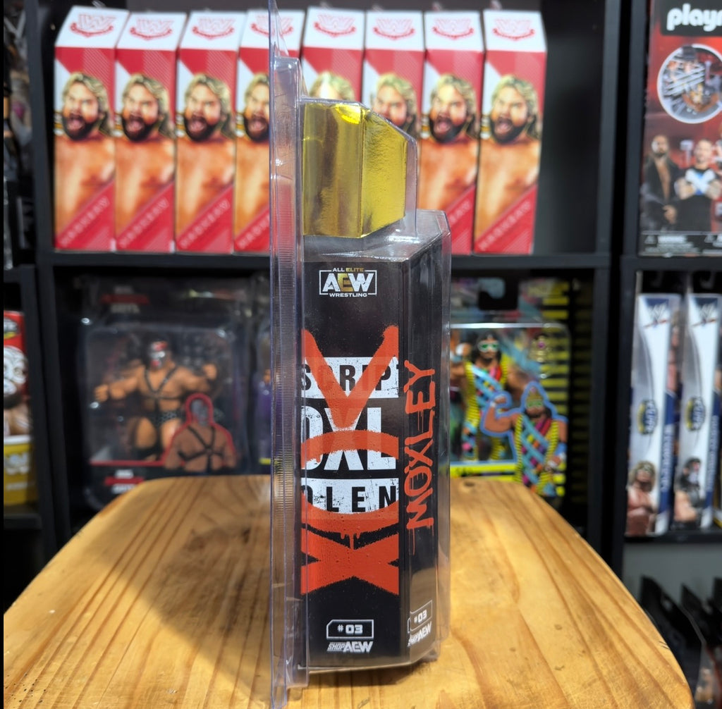 Jon Moxley AEW action figure box with gold side panel and red vertical logos