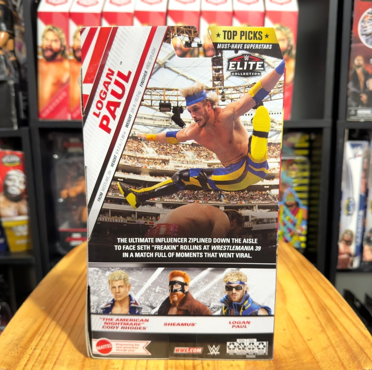 WWE Elite Top Picks Logan Paul action figure box back with arena illustration and text