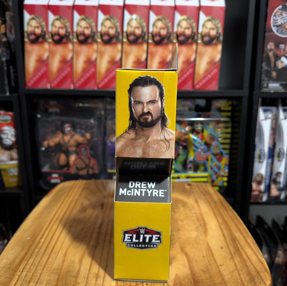 Drew McIntyre Elite action figure in yellow retail box with logo and name