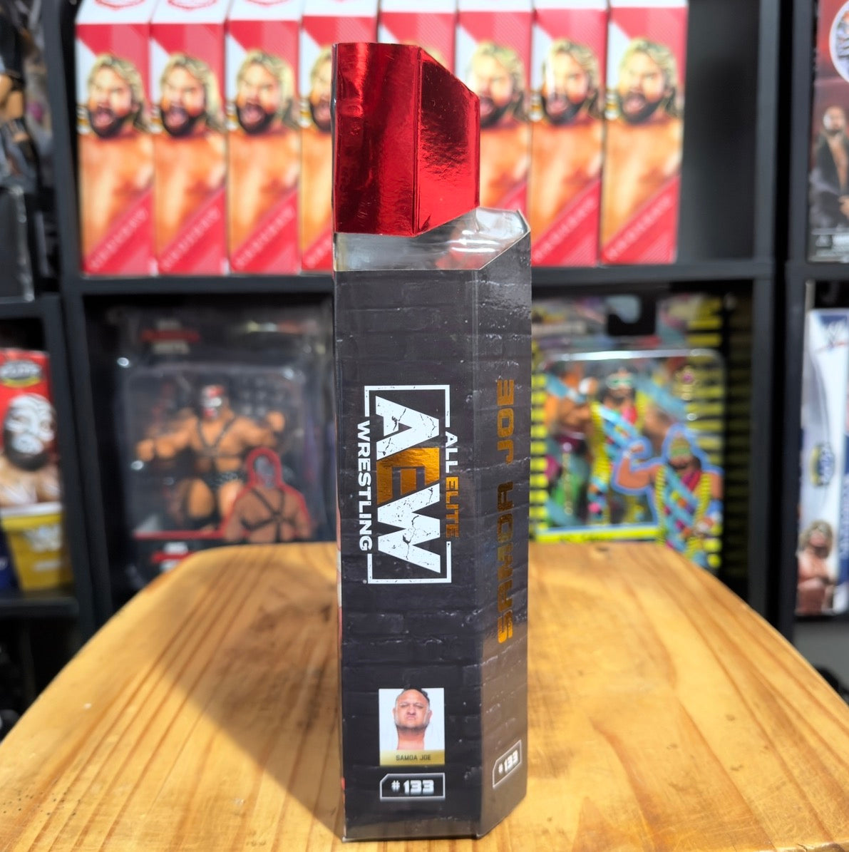 Wrestling action figure display box back, black with red top and wrestler portrait