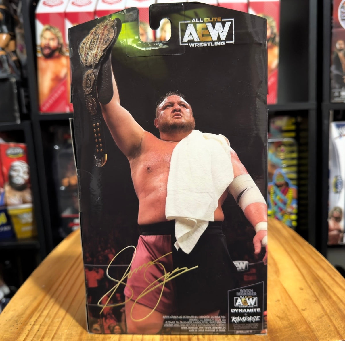 Wrestling action figure in front box, Samoa Joe holding towel over shoulder