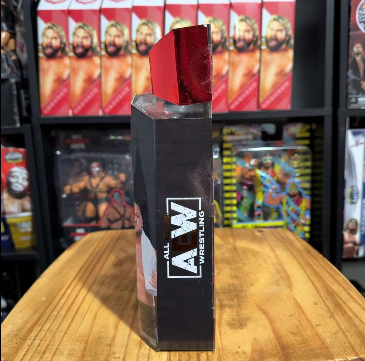 Wrestling action figure display box, black with red foil top and side logo window