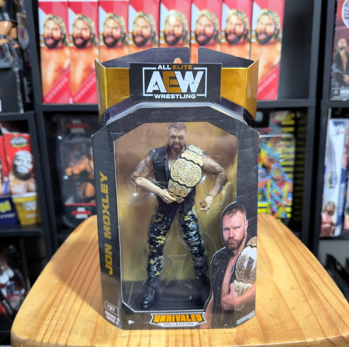 AEW Unrivaled action figure in blister, holding a championship belt