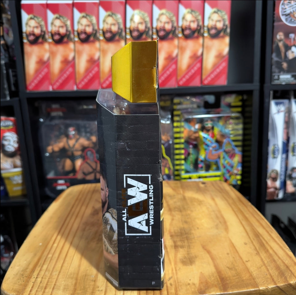 Wrestling action figure packaging with yellow top and AEW All Elite Wrestling text