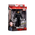 Undertaker action figure in black coat and hat, enclosed in WrestleMania box